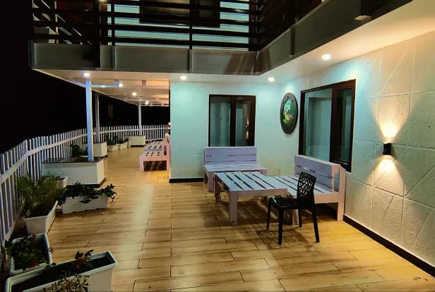 Morning tea on the balcony with Himalayan mountain backdrop