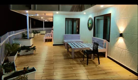 Madhuram Stays property illuminated at night with bonfire